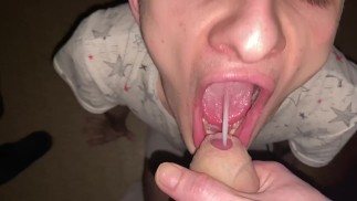 A young passive sucks a dick and gets sperm in her mouth