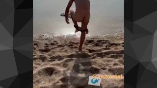 Hot boy at the beach taking his clothes off