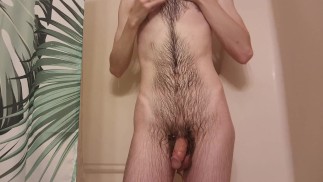 Tall skinny guy taking a hot shower