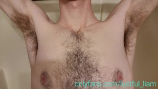Tall boy playing with his hairy armpits in the shower