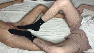 Stepbro treated me with a sockjob then footjob. I came handsfree