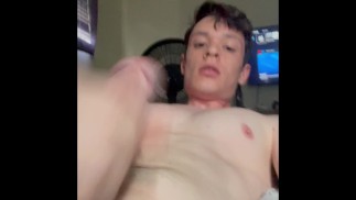 Hunk jerks his cock until he explodes cum